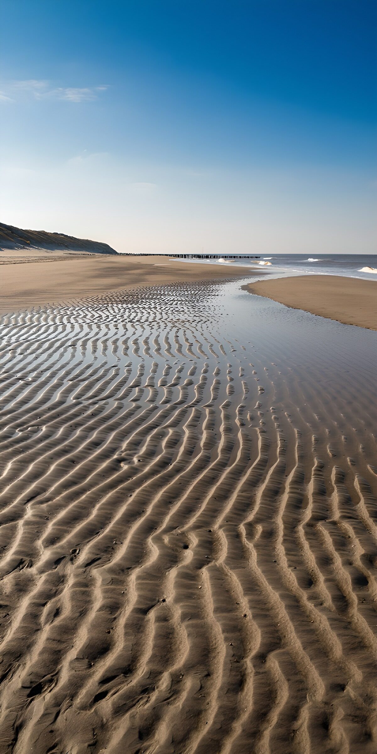 OCCOM9678227: Serene Beach Patterns Under Clear Sky