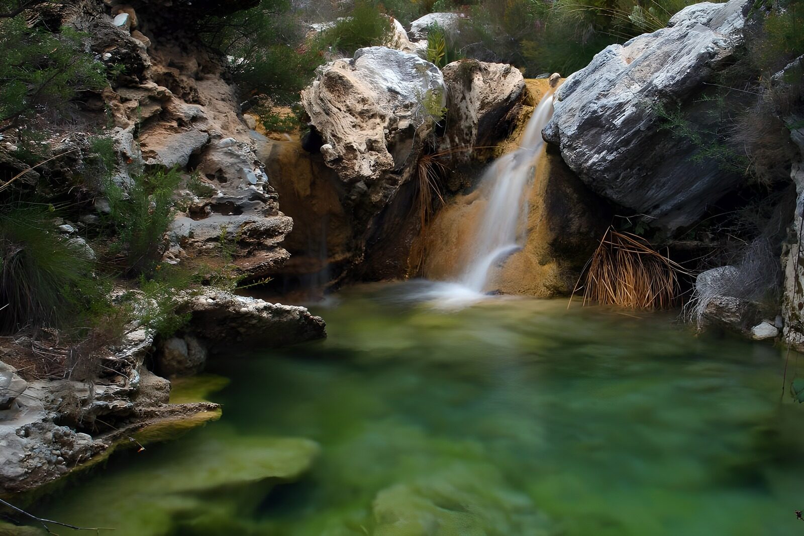 OCCOM7603308: Tranquil Waterscape with Cascading Waterfall