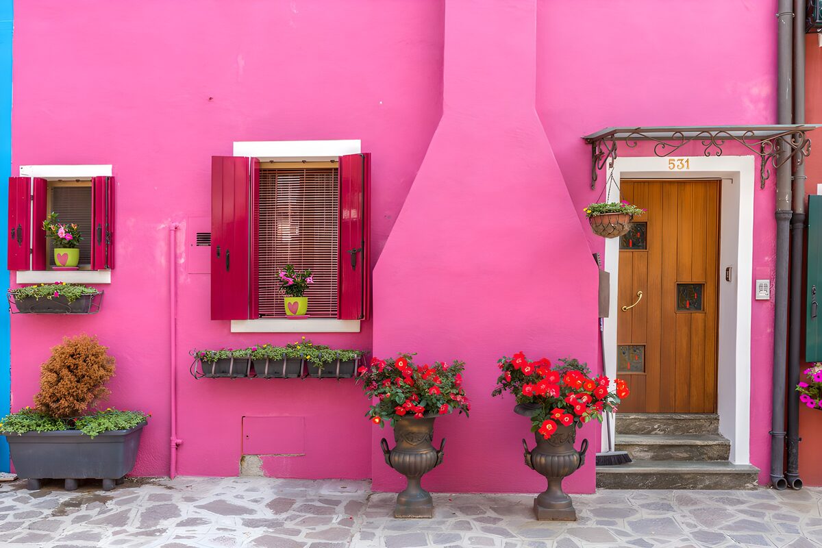 Vibrant Pink Facade with Floral Accents