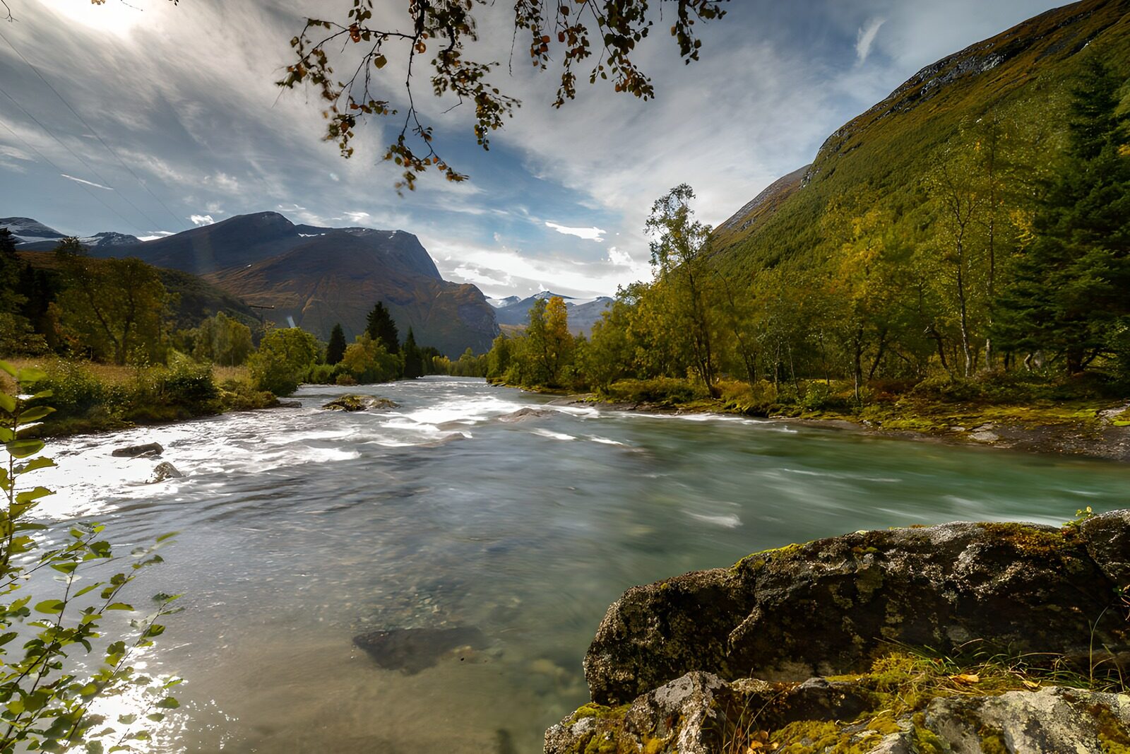 OCCOM5809149: Serene River Flowing Through Mountains