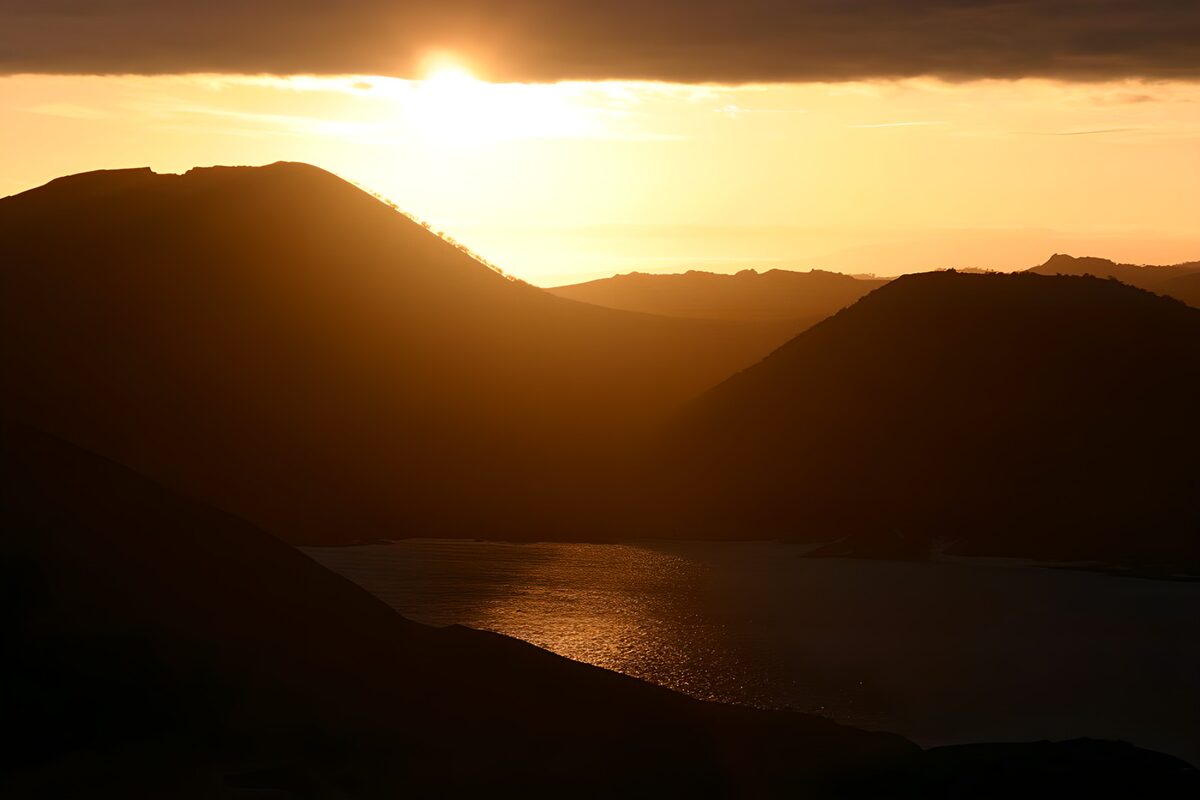 Serene Sunset Over Silhouetted Hills