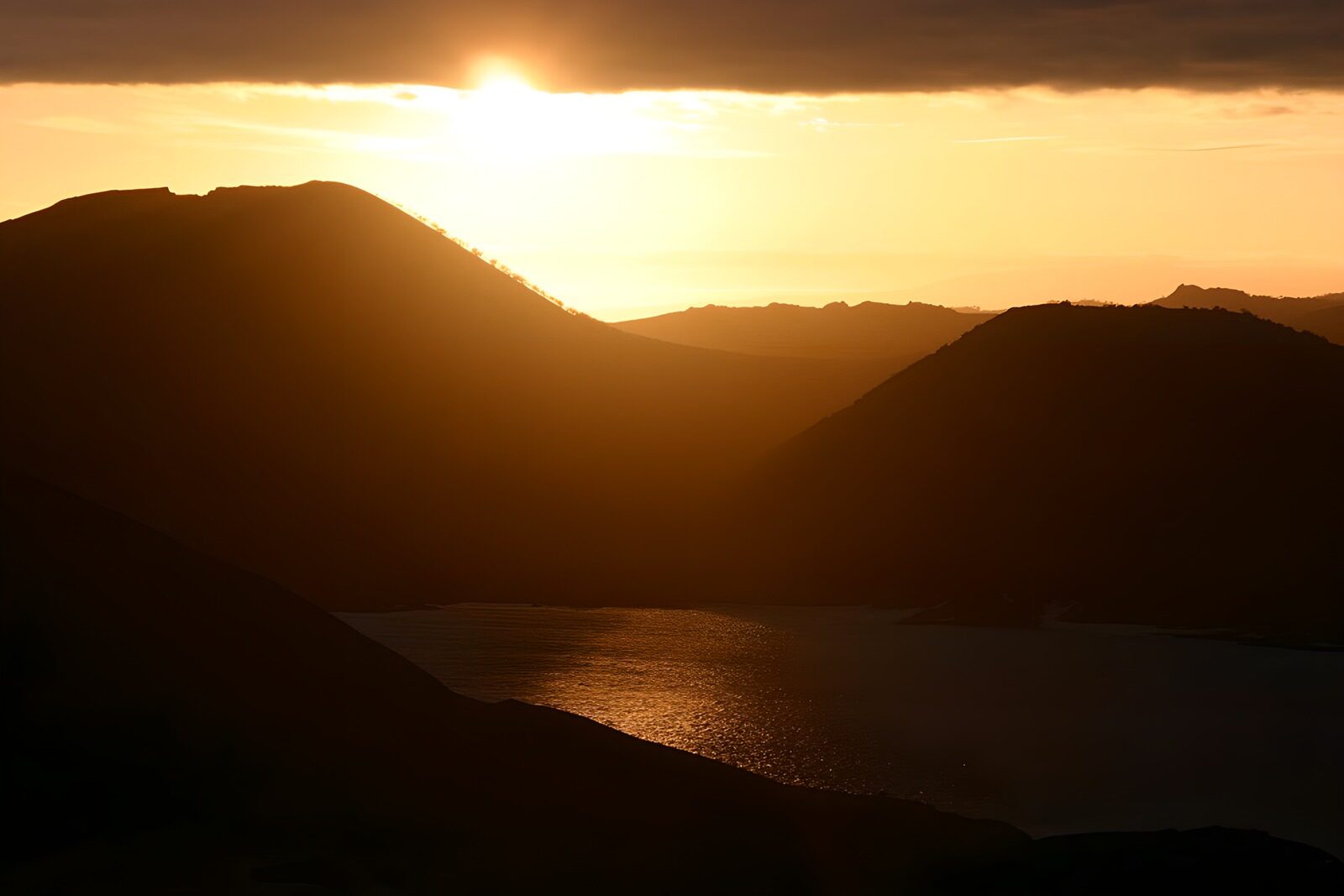 OCCOM8341534: Serene Sunset Over Silhouetted Hills
