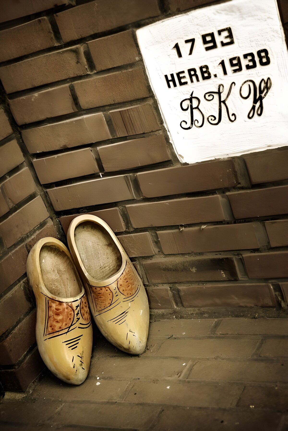OCCOM9669257: Traditional Wooden Clogs by a Wall