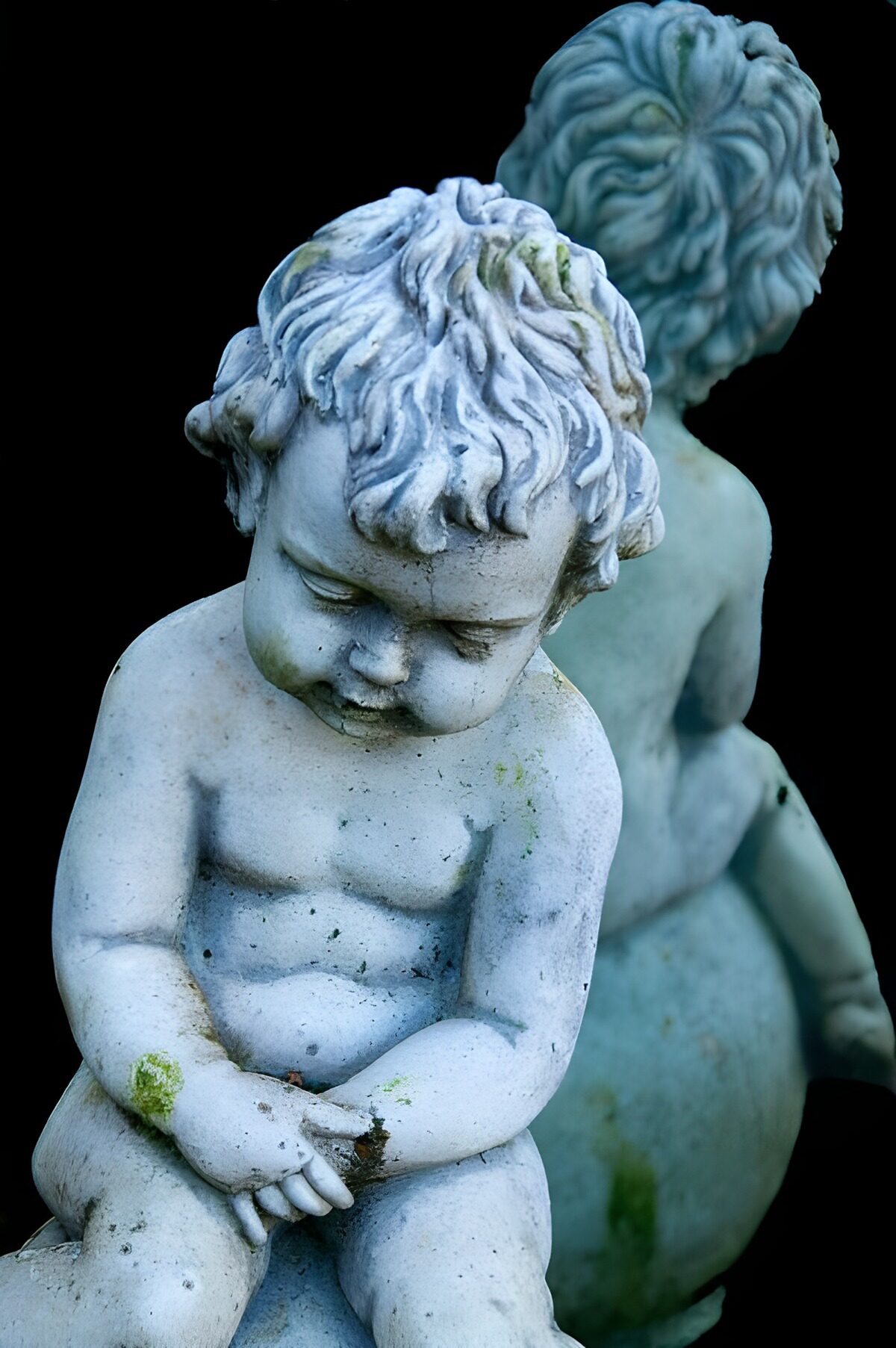 OCCOM4857832: Weathered Cherub Statue