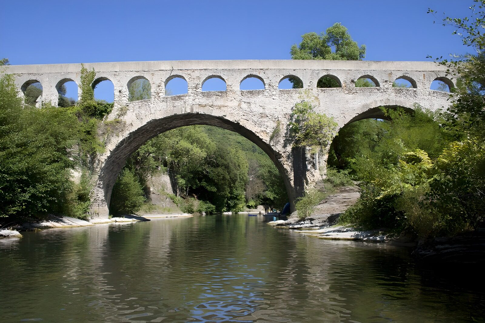 OCCOM3838287: Historic Stone Arch Bridge Over Water