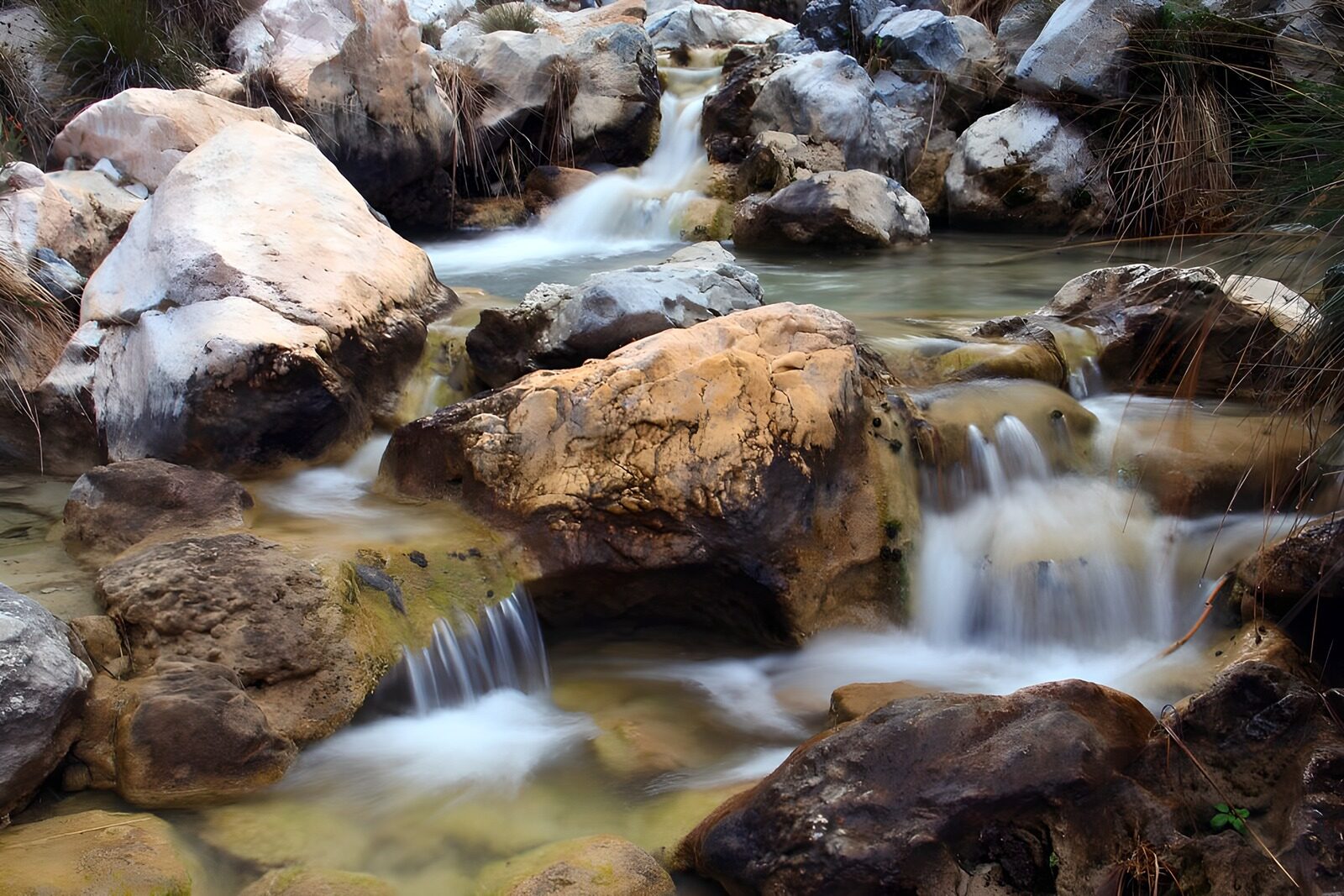 OCCOM7374854: Tranquil Stream Flowing Over Rocks