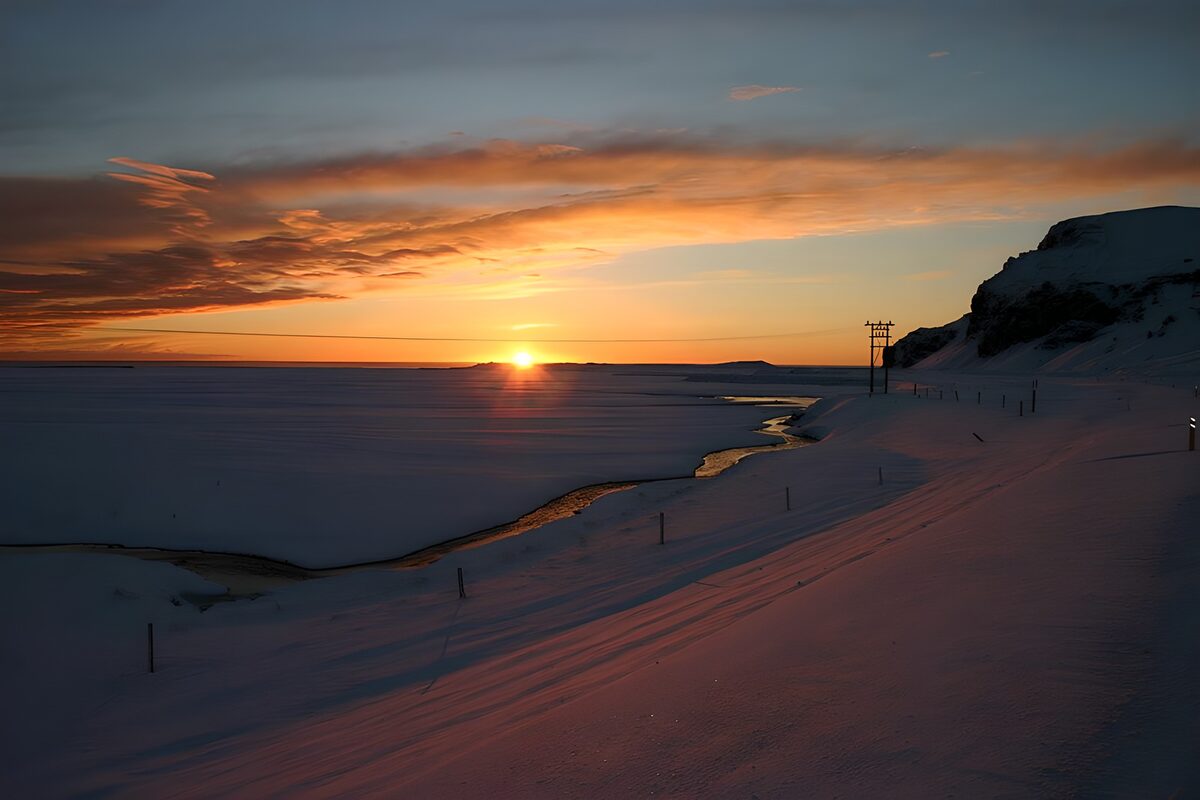 Serene Sunset Over Snowy Landscape
