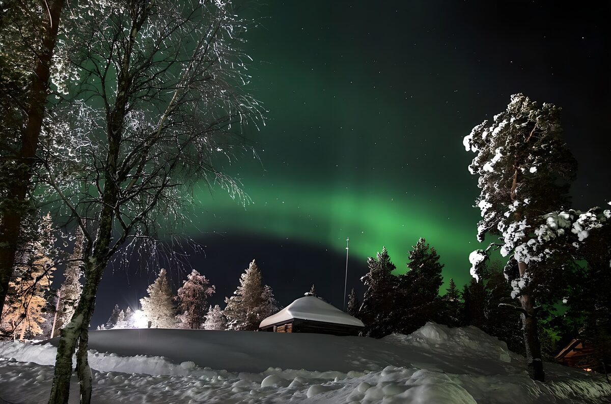 Enchanting Northern Lights Over Snowy Landscape