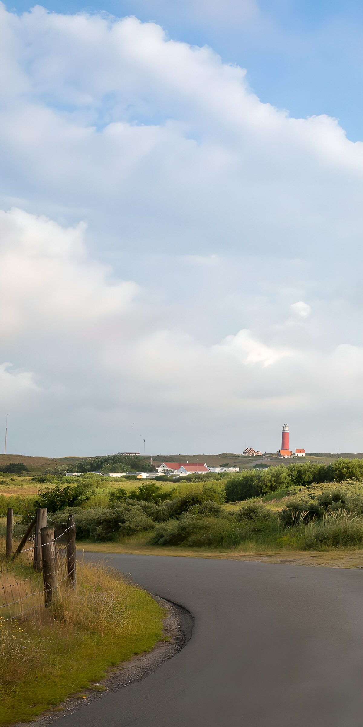OCCOM5111814: Lighthouse View on a Scenic Road