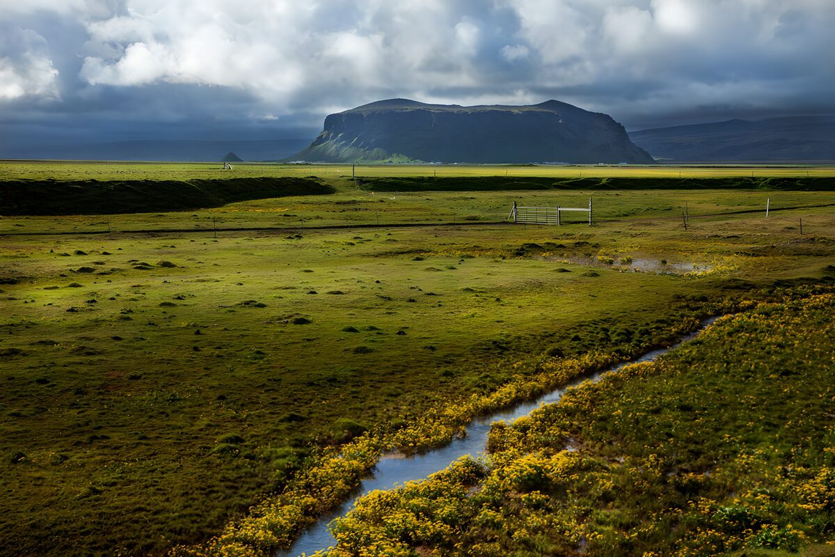 Serene Highland Landscape Under Cloudy Skies