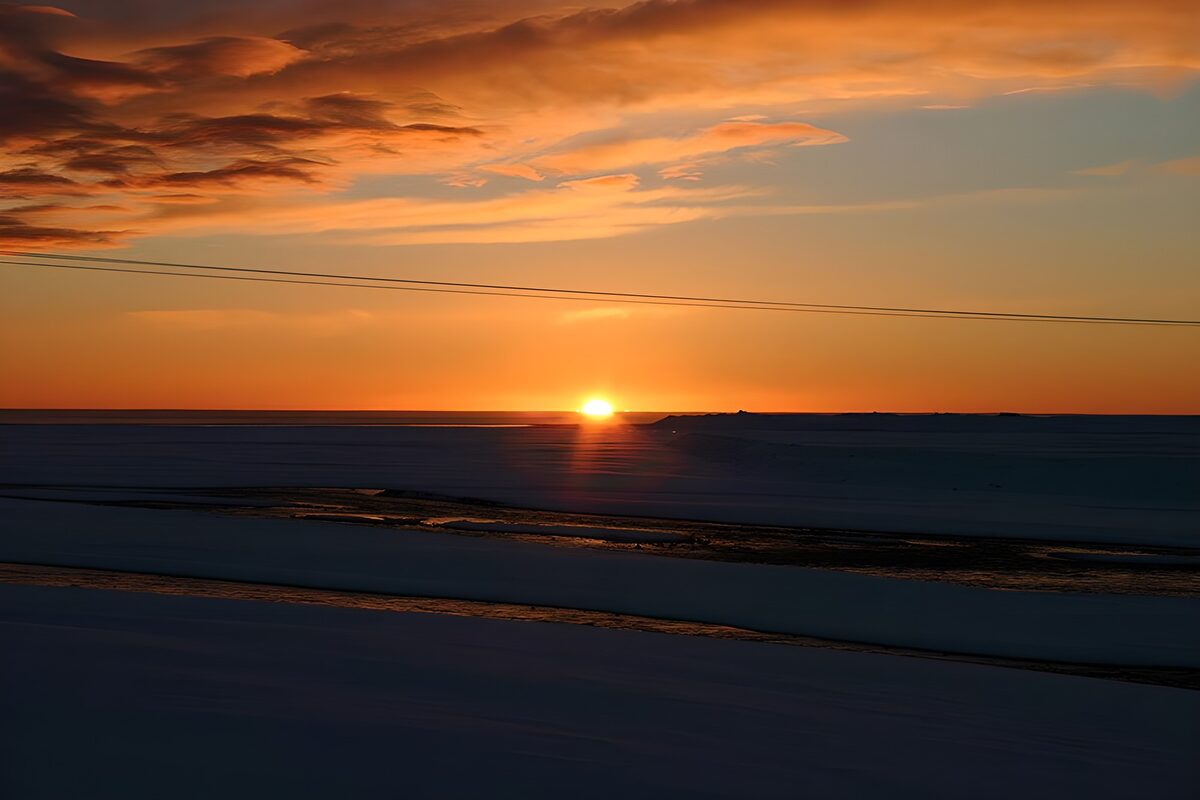 Sunset Over Snowy Landscape