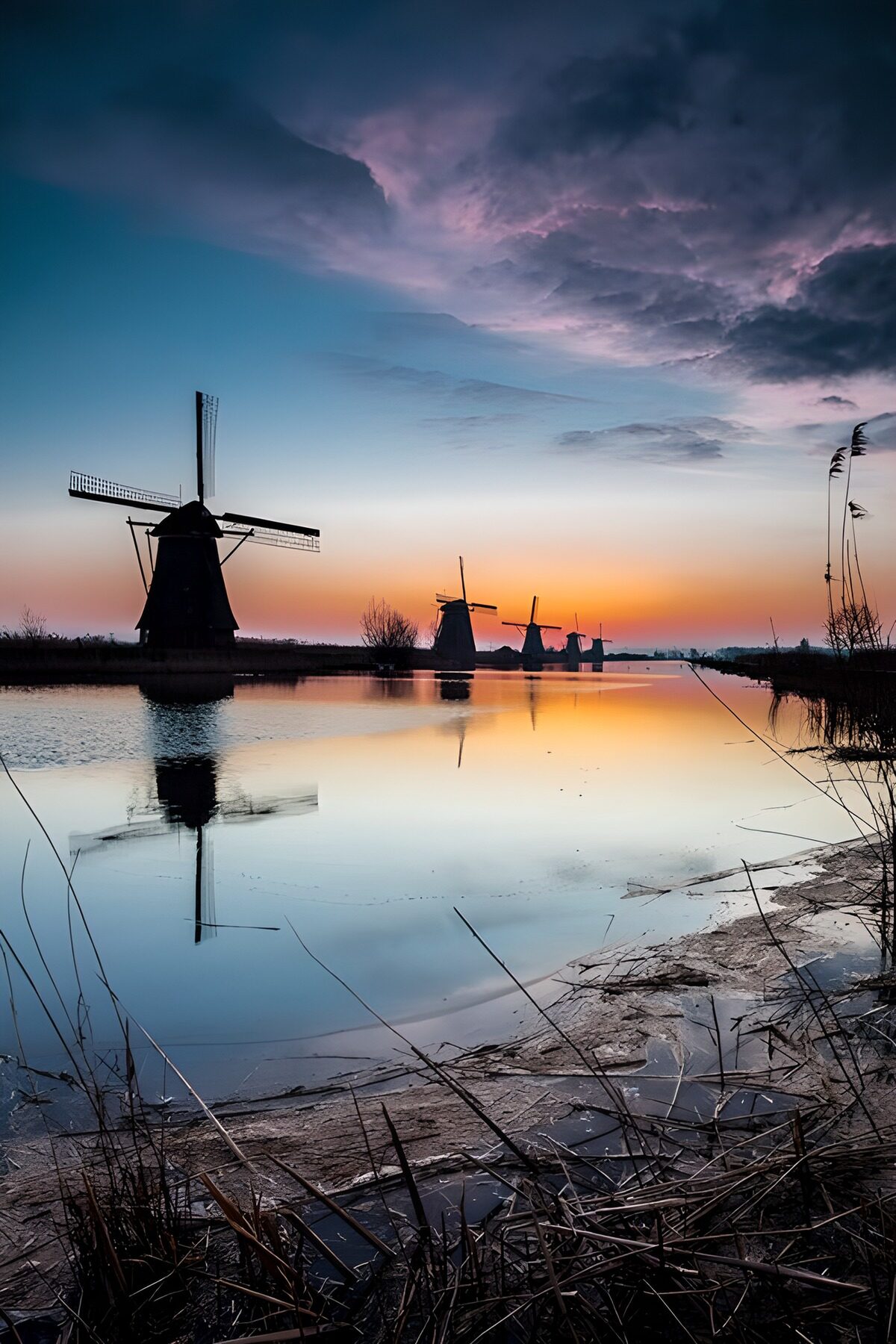 "Sunset Over Historic Windmills"
