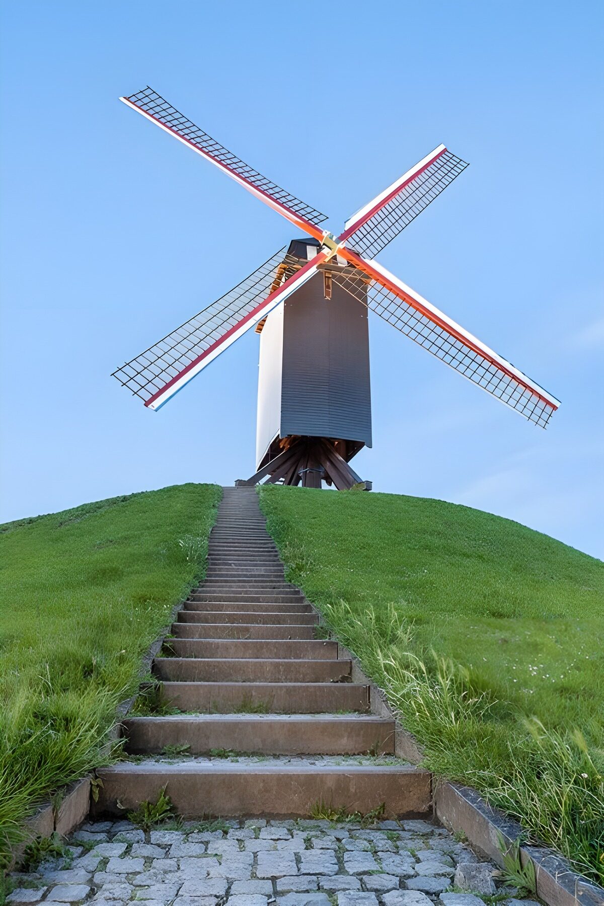 Classic Windmill on a Green Hill
