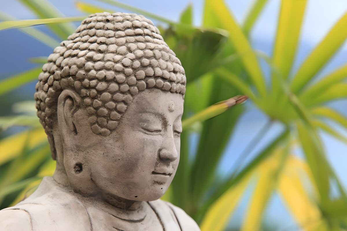 Serene Buddha Among Tropical Greens
