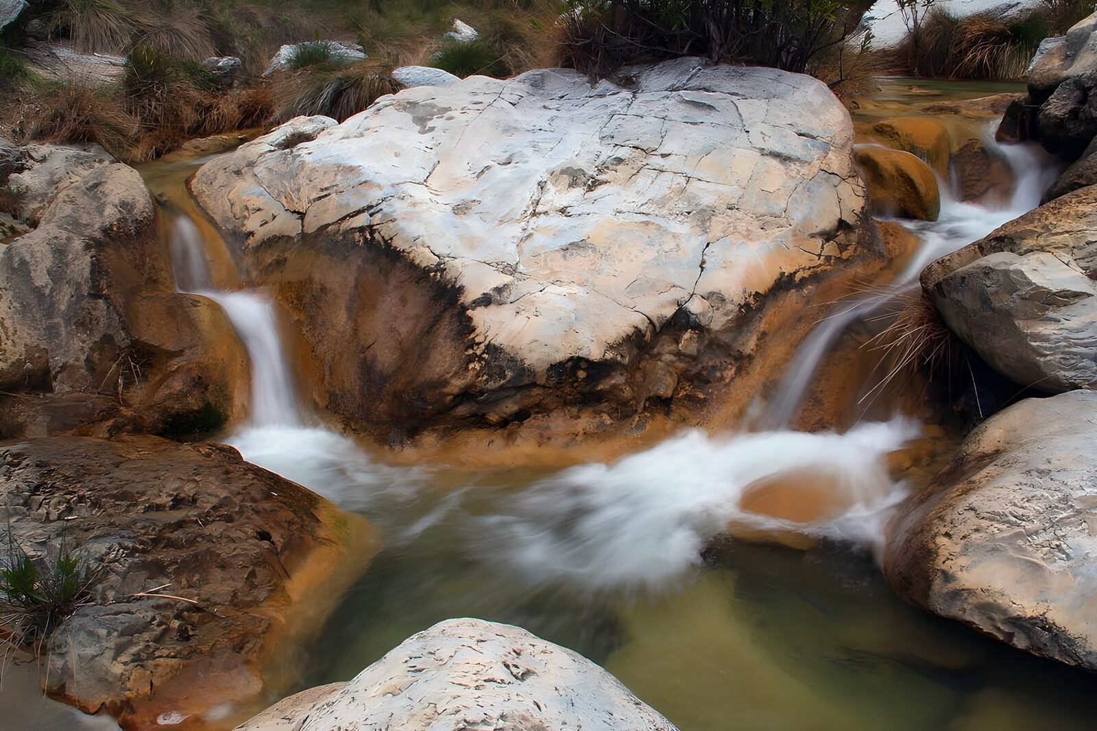 OCCOM9996054: Tranquil Stream Flowing Over Rocks