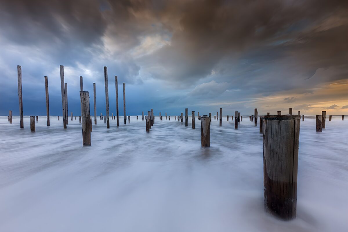 Tranquil Waters and Weathered Pillars