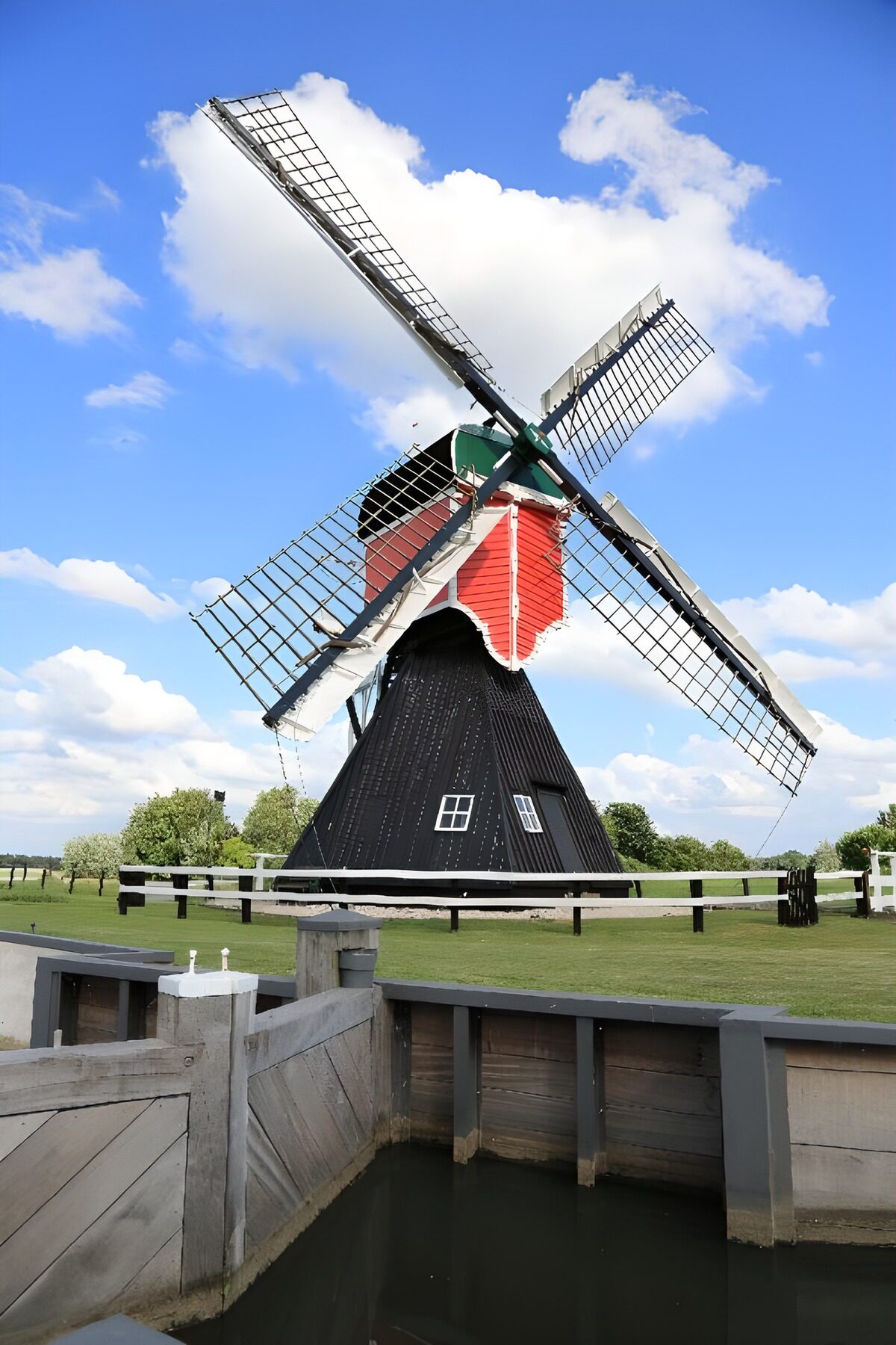 Traditional Dutch Windmill by the Water