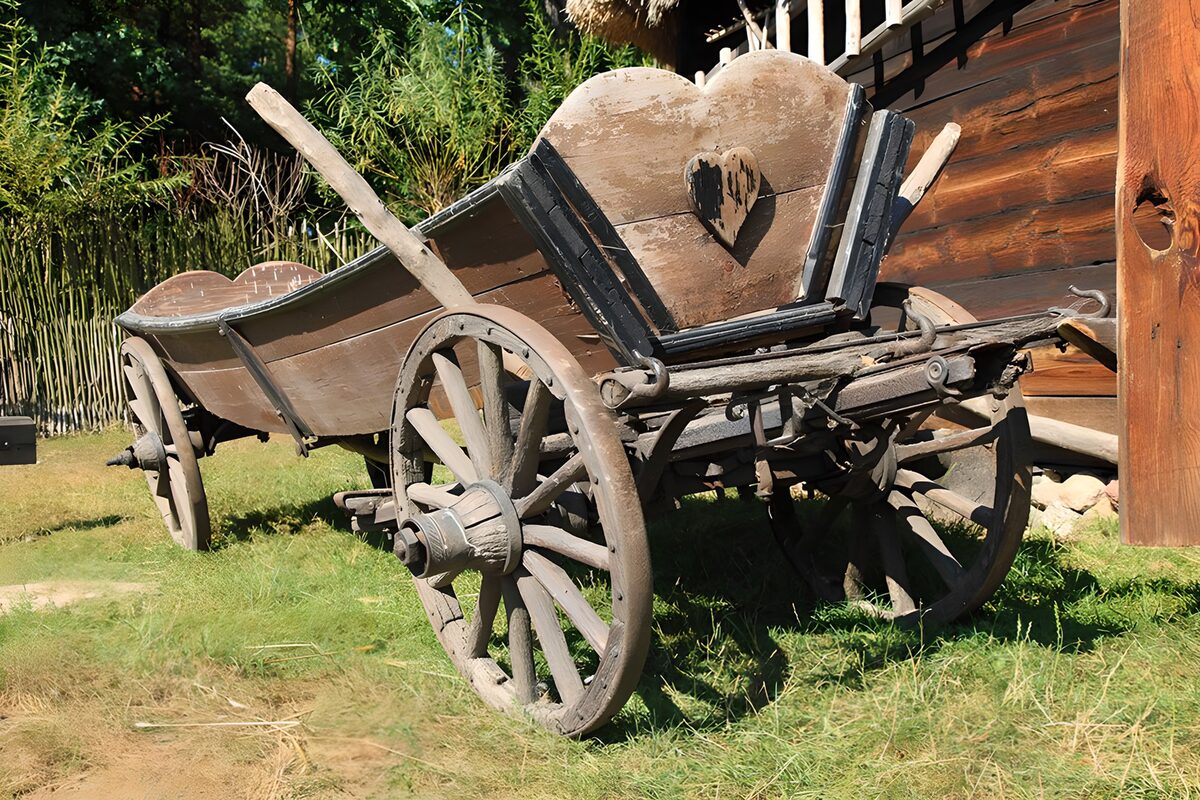 OCCOM7709685: Vintage Wooden Cart in Rustic Setting