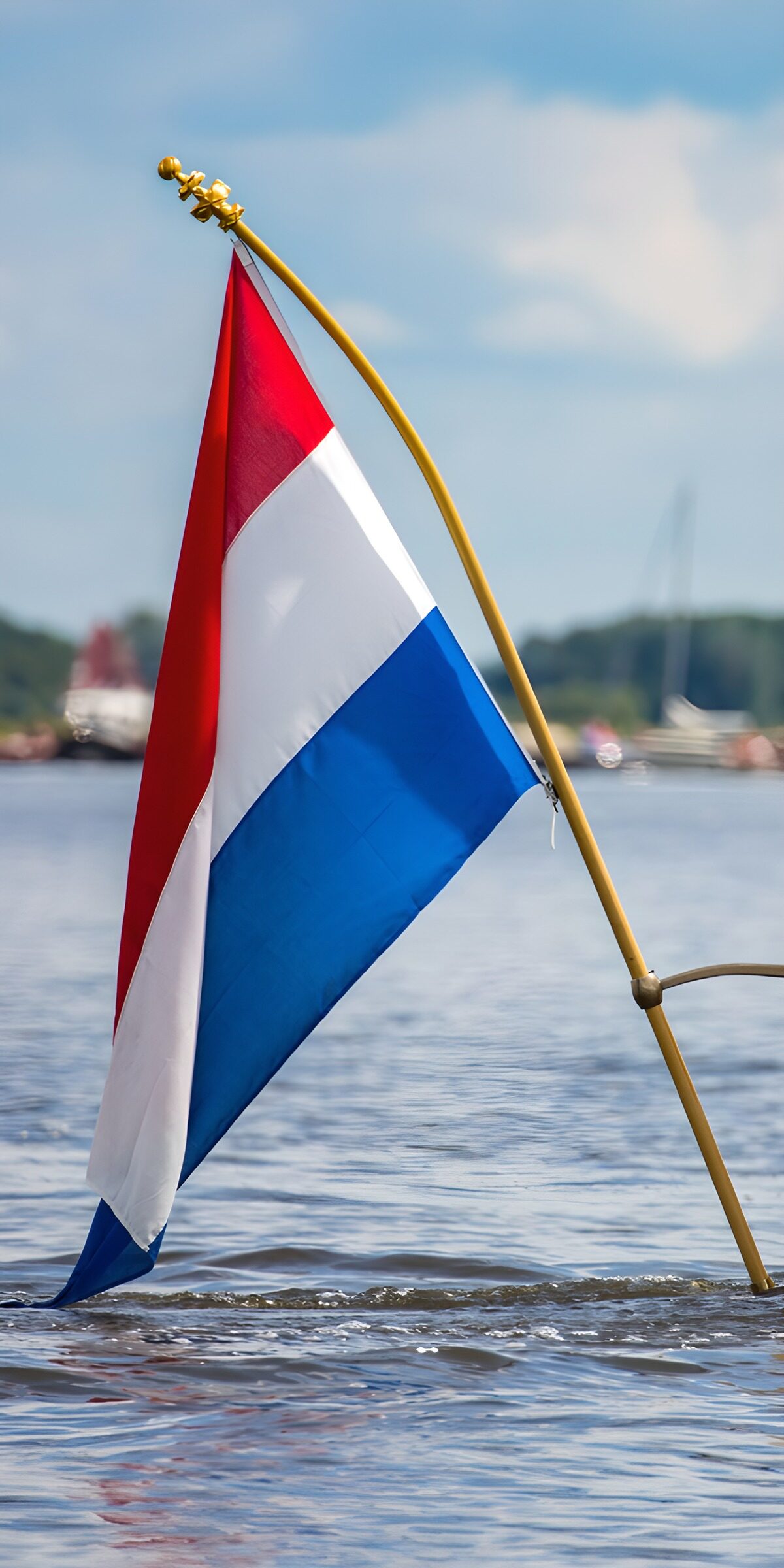 OCCOM8983248: Dutch Flag on a Calm Water Surface