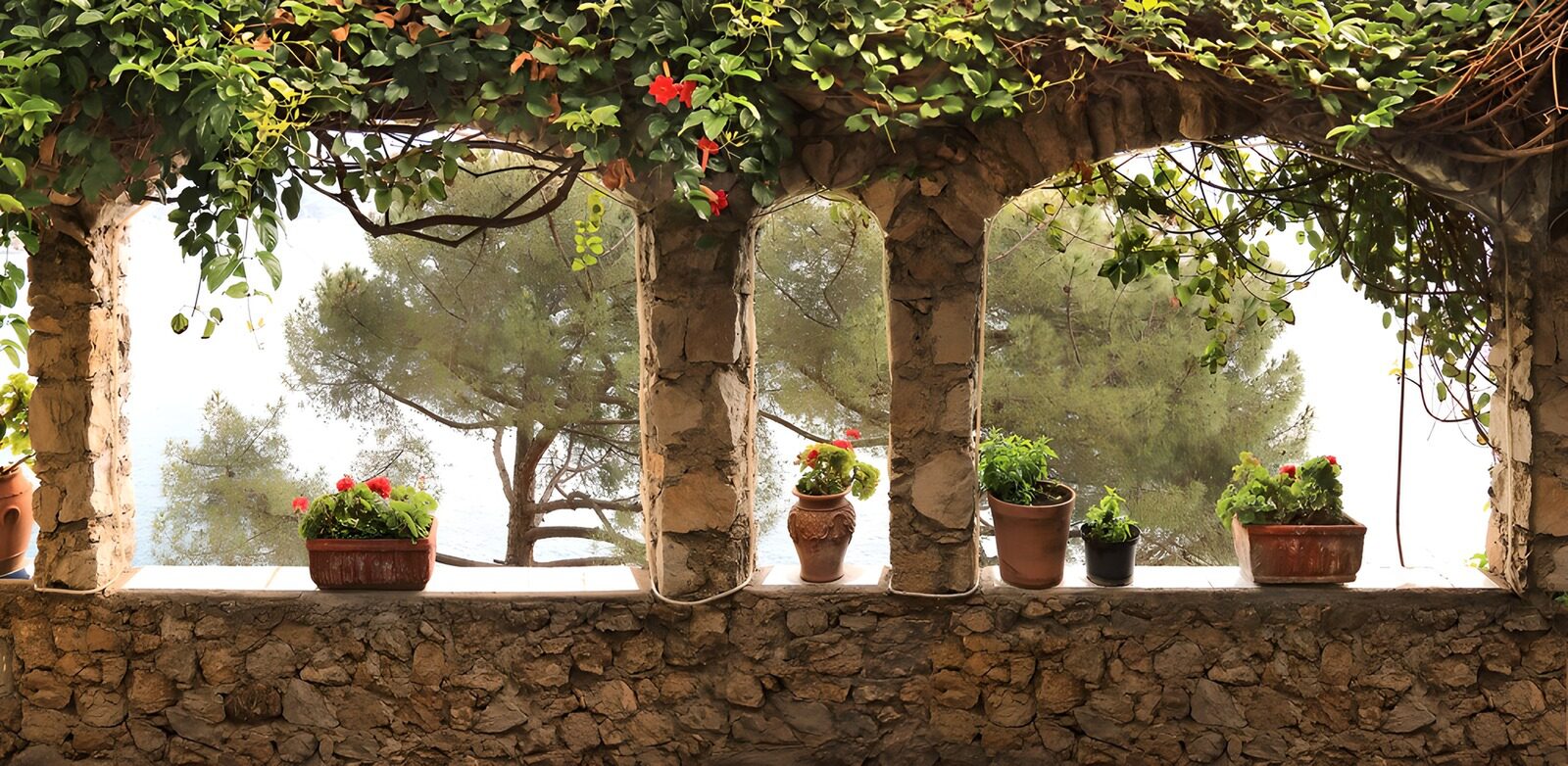 OCCOM3591436: Serene Garden View Through Stone Arches