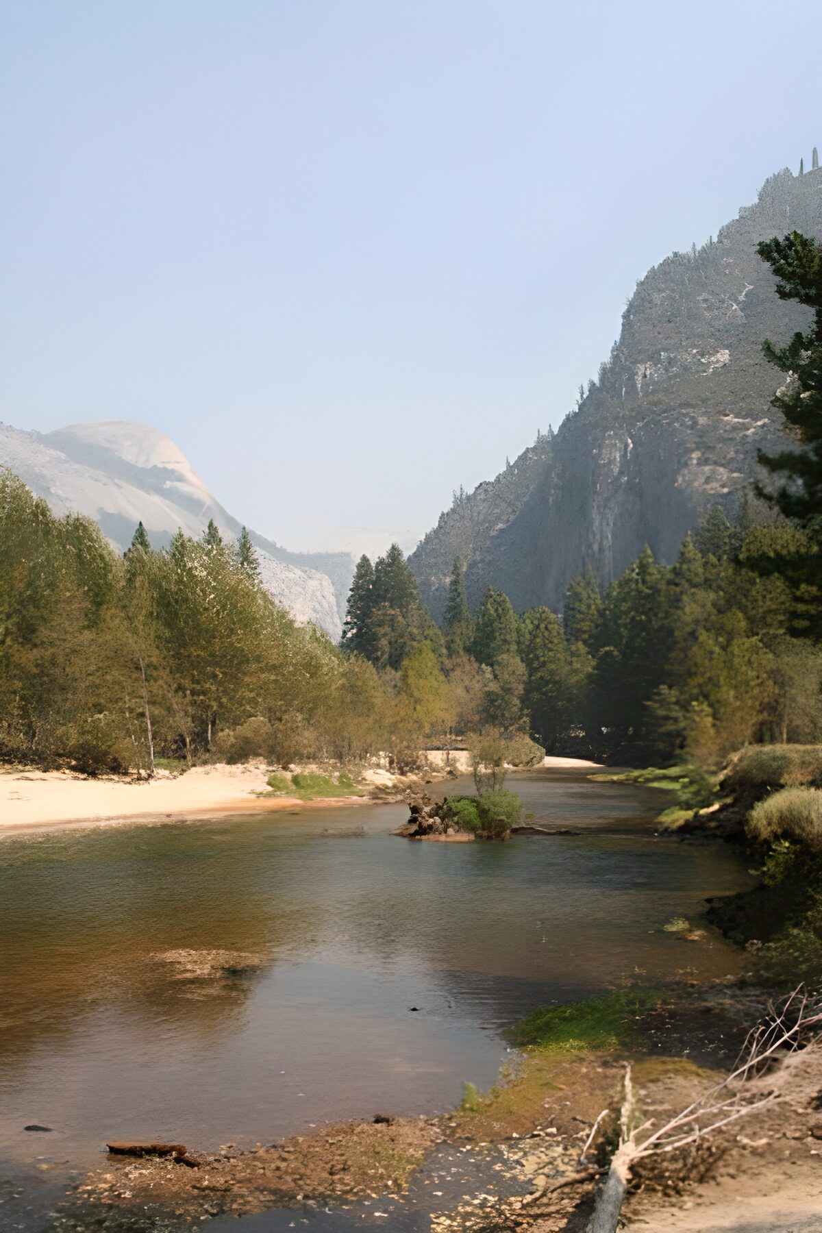 OCCOM9212230: Serene River Flowing Through Tall Mountains