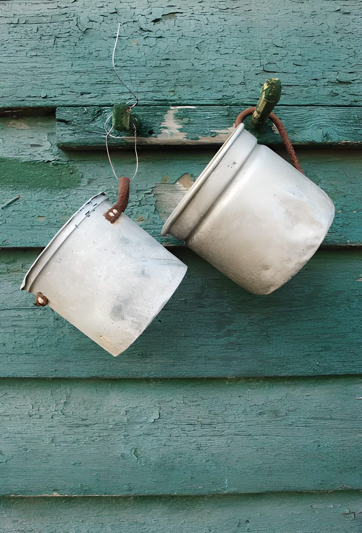 OCCOM2877724: Rustic Metal Buckets on Wood Wall