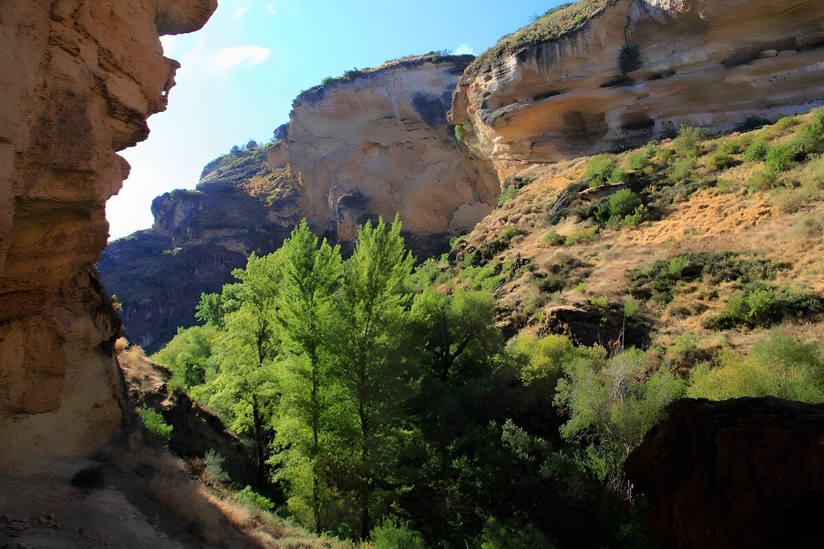 Serene Oasis Amidst Rugged Cliffs