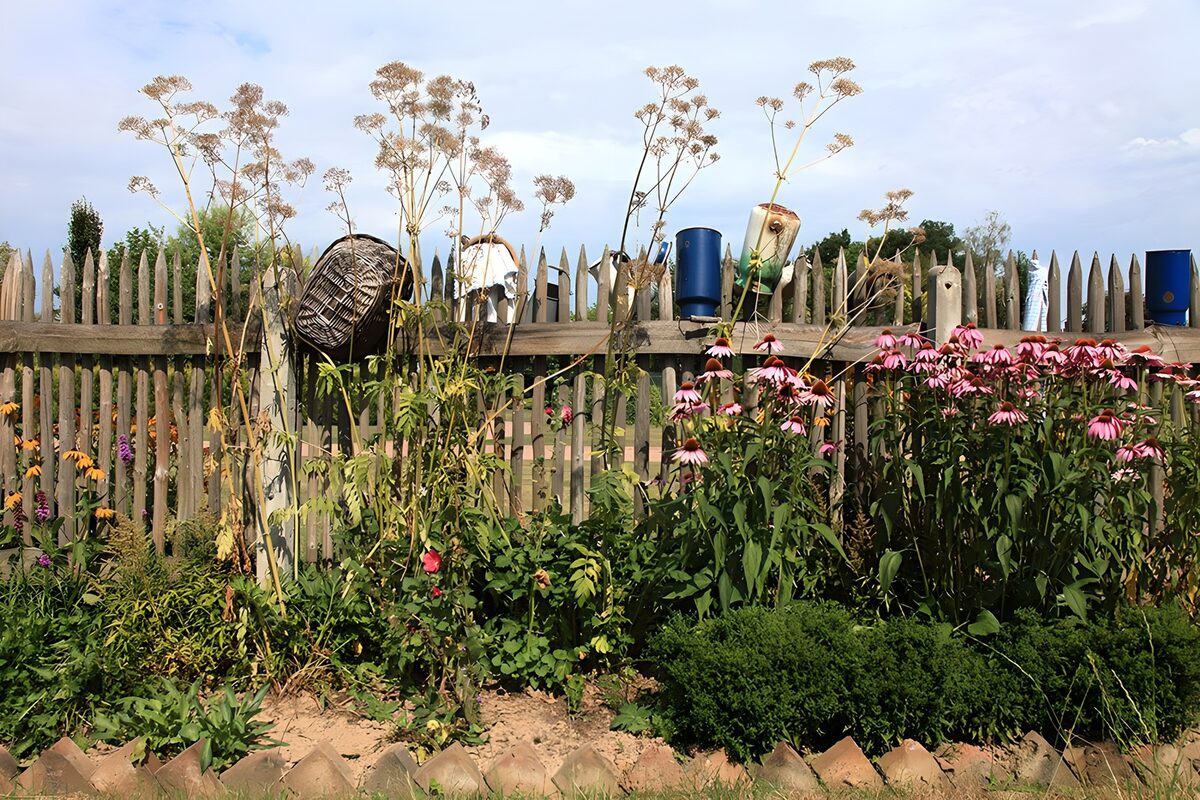 Charming Garden Fence with Wildflowers
