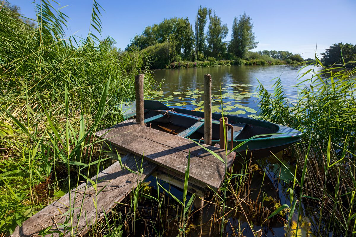 Tranquil River Scene with a Small Boat