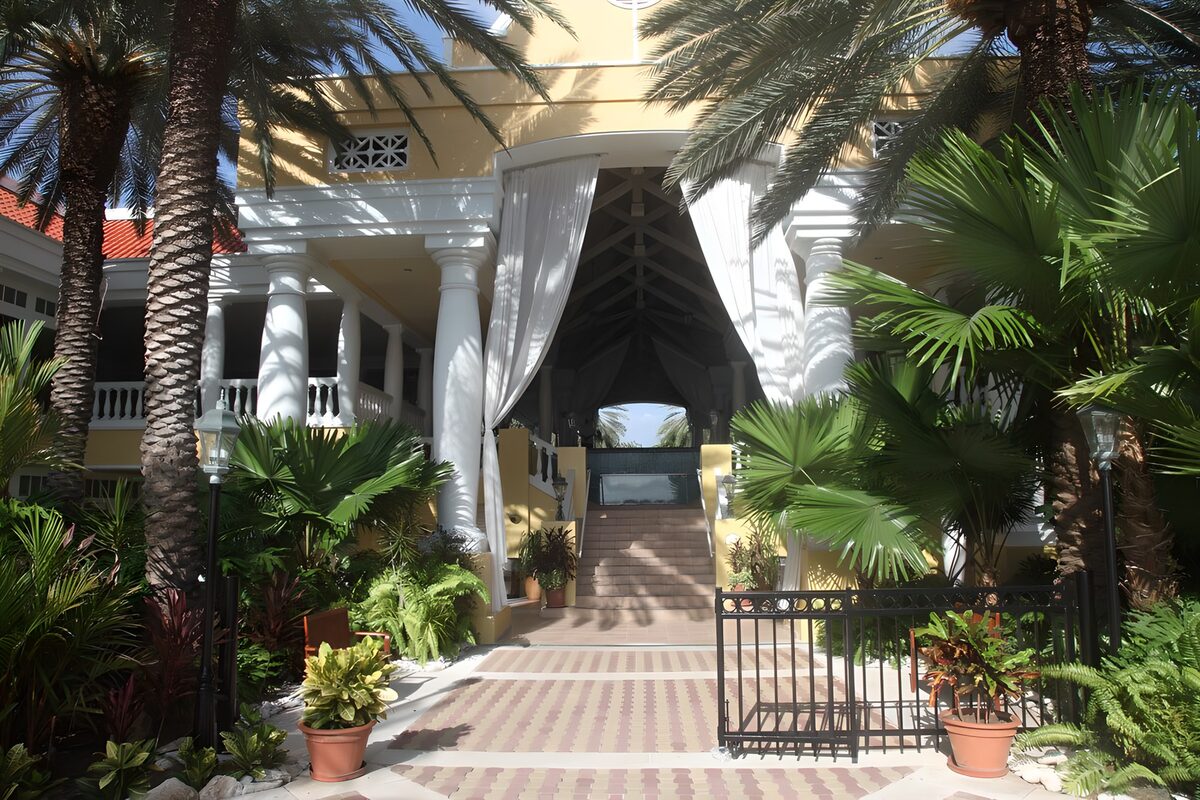 OCCOM3231015: Elegant Entrance Surrounded by Palm Trees