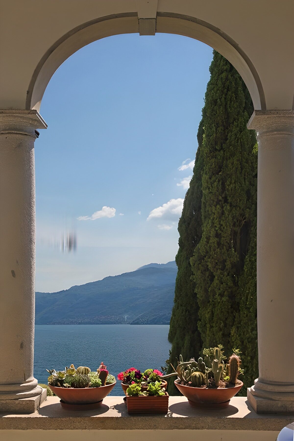 OCCOM1950590: Serene Lake View Through Arched Window
