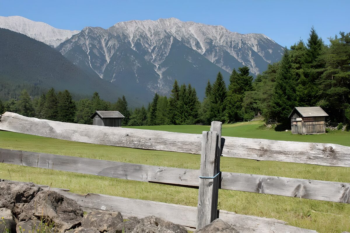 Serene Mountain Landscape with Wooden Fences