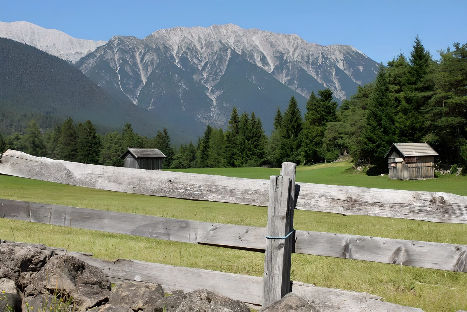 OCCOM3451786: Serene Mountain Landscape with Wooden Fences
