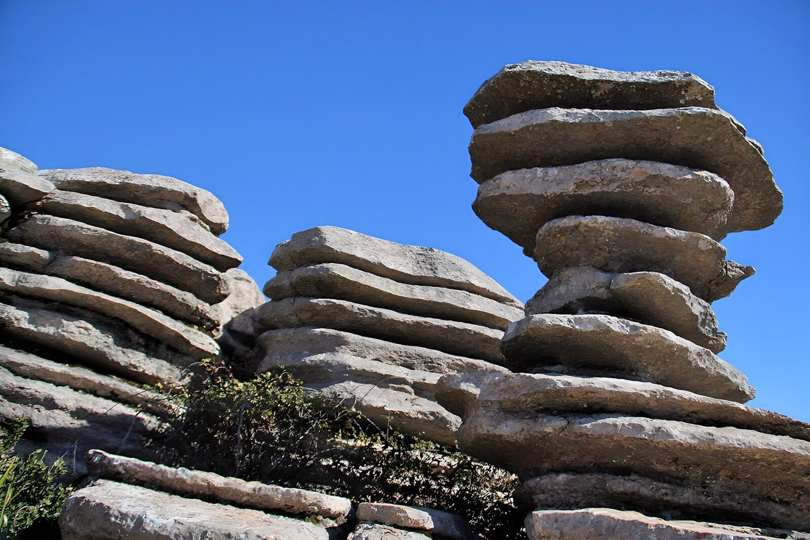 OCCOM4569248: Stacked Stones Against a Clear Sky