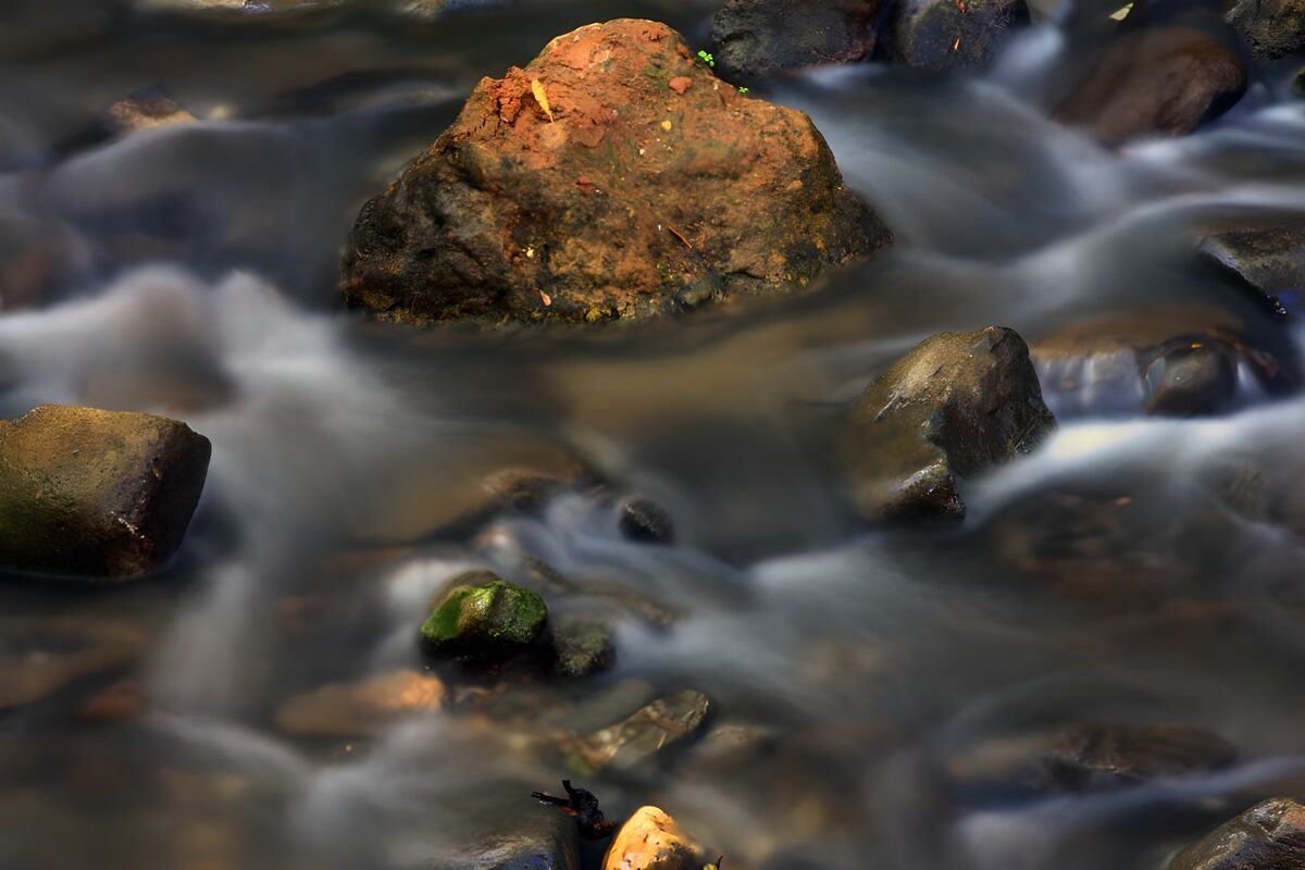 Tranquil River Flow with Stones