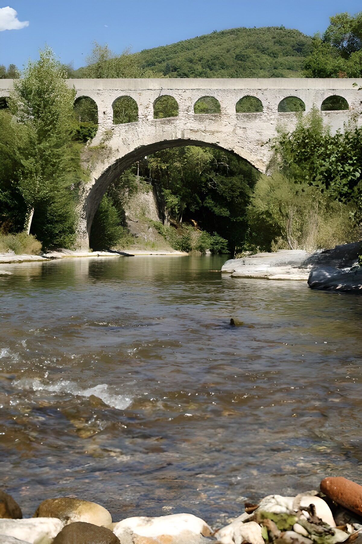 Tranquil Stone Bridge Over Clear Waters