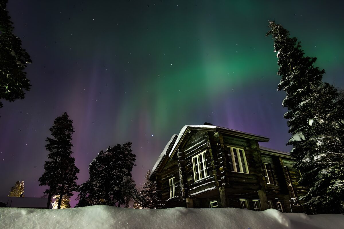 Enchanted Aurora Above a Winter Cabin