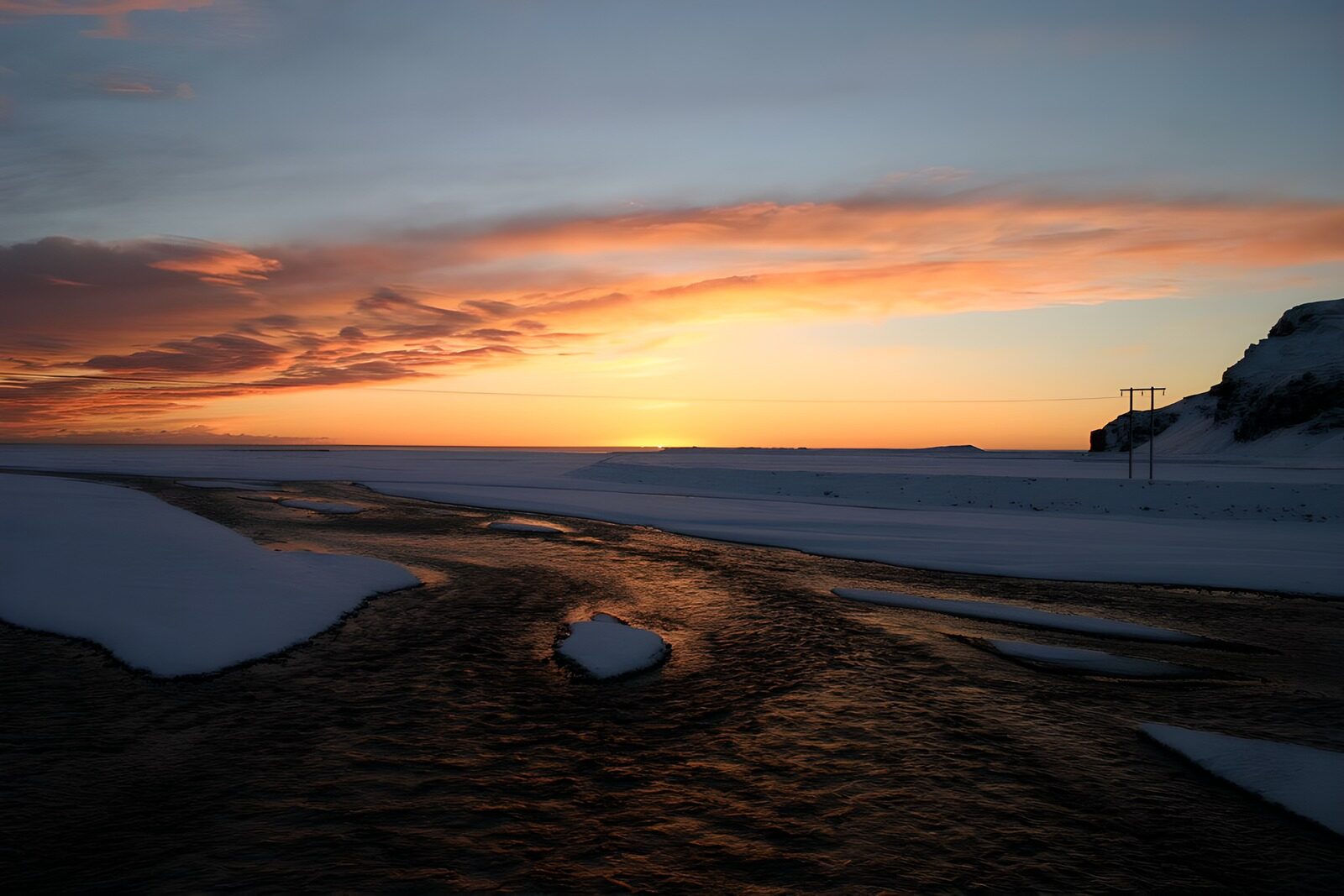 OCCOM4958603: Serene Winter Sunset Over Snowy Landscape