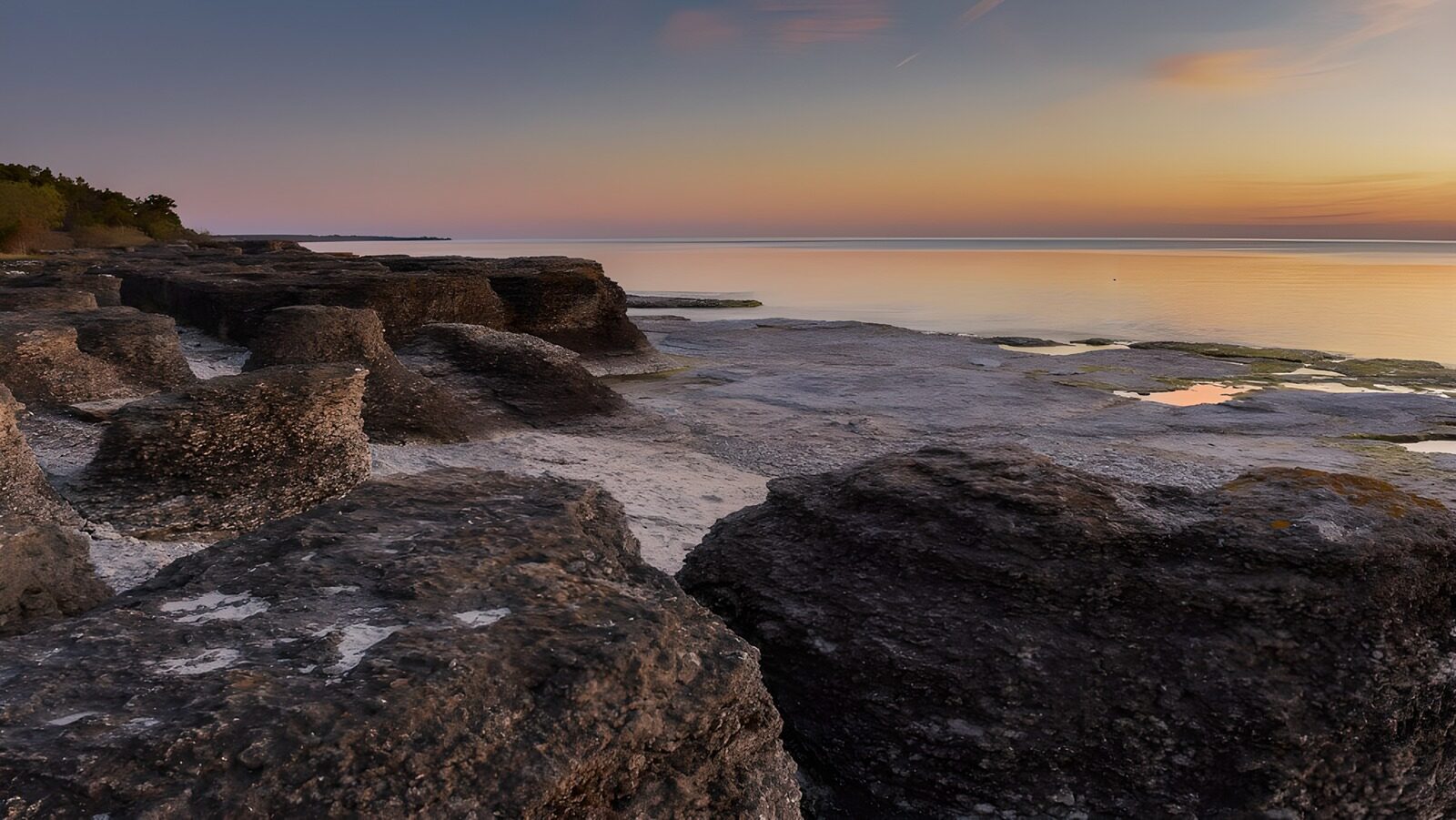 OCCOM5781149: Serene Seaside Rock Formation at Dusk