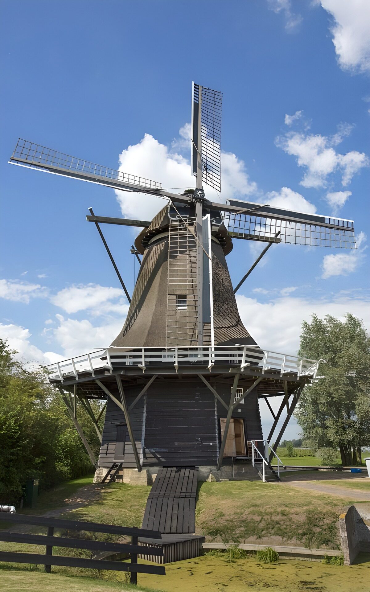 OCCOM8180946: Classic Dutch Windmill in Scenic Landscape