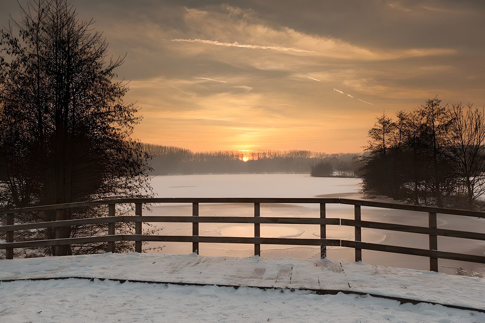 OCCOM7792906: Serene Winter Sunset Over Frozen Lake