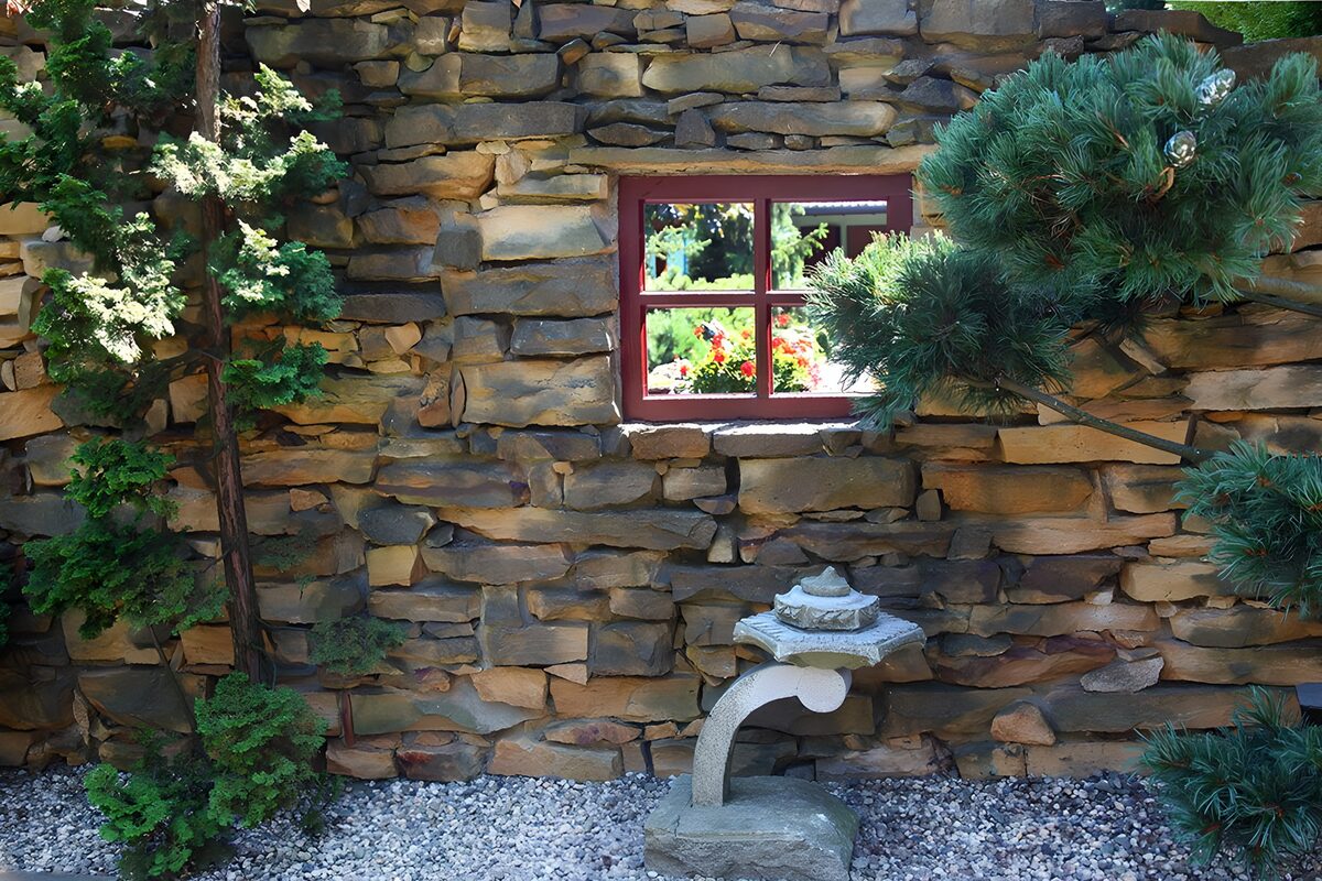 OCCOM9875565: Tranquil Garden View Through Stone Wall